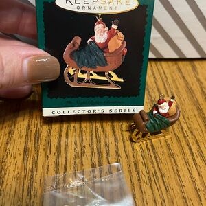 Hallmark miniature Santa in Sleigh Ornament with Gold Accents.